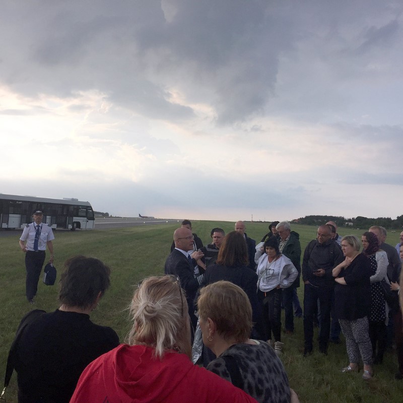 Passengers stand on the grass next to a runway after being evacuated from a Scandinavian Airlines Systems plane which was forced to make an emergency landing shortly after takeoff due to smoke in the cabin, at Gdansk airport, Poland June 20, 2017, in this picture obtained from social media. Sergey Shtypuliak via REUTERS NO RESALES. NO ARCHIVES. THIS IMAGE HAS BEEN SUPPLIED BY A THIRD PARTY. MANDATORY CREDIT
