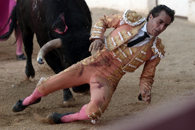 TOPSHOT - EDITORS NOTE: Graphic content / Spanish matador Ivan Fandino is impaled by a Baltasar Iban bull during a bullfight at the Corrida des Fetes on June 17, 2017 in Aire sur Adour, southwestern France. Spanish matador Ivan Fandino died after being impaled by a Baltasar Iban bull during a bullfight in Aire sur Adour, southwestern France, during the Corrida des Fetes. / AFP PHOTO / IROZ GAIZKA (Photo credit should read IROZ GAIZKA/AFP/Getty Images)