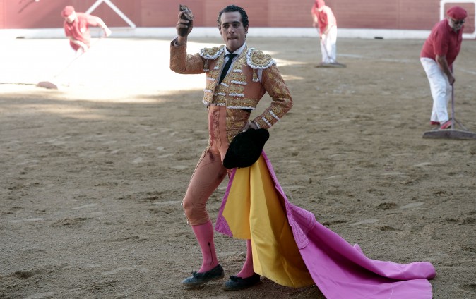 Spanish matador Ivan Fandino holds the ear of a Baltasar Iban bull during a bullfight at Aire sur Adour arena southwestern France, on June 17, 2017. / AFP PHOTO / IROZ GAIZKA (Photo credit should read IROZ GAIZKA/AFP/Getty Images)
