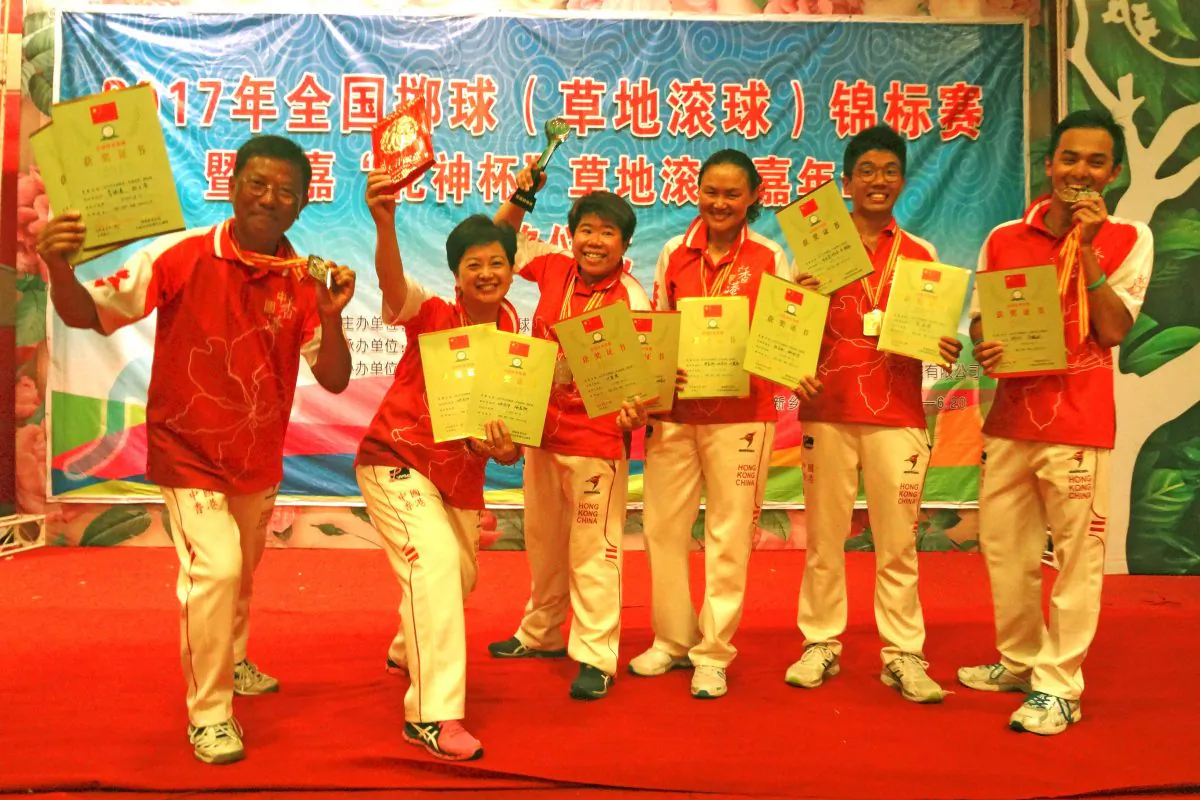 PRIDE OF HONG KONG – The Hong Kong lawn bowls team proudly displays the three trophies they won at the 2017 Chinese National Lawn Bowls Championship in Henan. Team members include (L-R) Li Ming Sum, Camilla Leung, Vivian Yip, Helen Cheung, James Po and Adrian Yau. (James Keung)