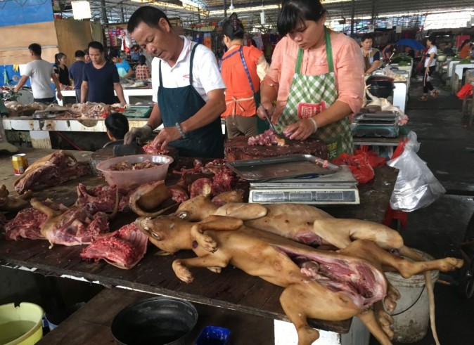 Vendors prepare dog meat at the Nanqiao market in Yulin, in China's southern Guangxi region on June 21, 2017. (Becky Davis/AFP/Getty Images)