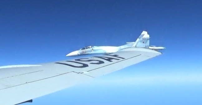 A U.S. RC-135U flying in international airspace over the Baltic Sea being intercepted intercepted by a Russian SU-27 Flanker June 19, 2017. (Courtesy photo/Released)