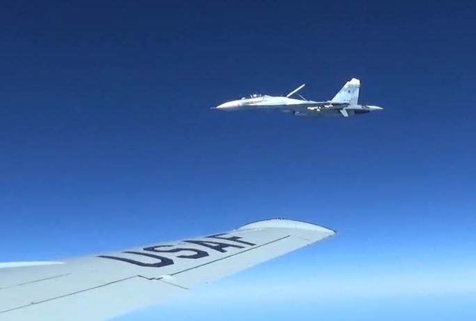 A U.S. RC-135U flying in international airspace over the Baltic Sea being intercepted intercepted by a Russian SU-27 Flanker June 19, 2017. (Courtesy photo/Released)