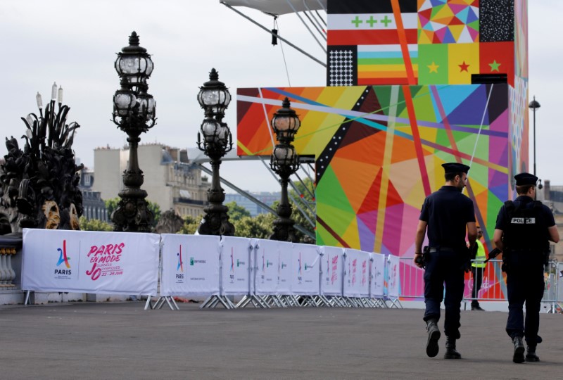 French police patrol on the Pont Alexandre III bridge near the Invalides in Paris, France, June 23, 2017 as Paris transforms into a giant Olympic park to celebrate International Olympic Days with a variety of sporting events for the public across the city during two days as the city bids to host the 2024 Olympic and Paralympic Games.  REUTERS/Jean-Paul Pelissier