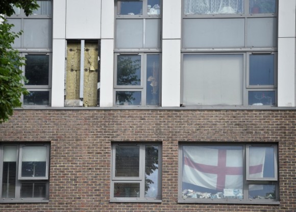 Cladding is seen on the Burnham Tower residential block, from where residents were evacuated as a precautionary measure following concerns over the type of cladding used on the outside of the building on the Chalcots Estate in north London, Britain, June 24, 2017. (Reuters/Hannah McKay)