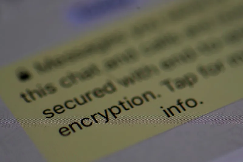 An encryption message is seen on the WhatsApp application on an iPhone in Manchester, England on March 27, 2017. (Reuters/Phil Noble)