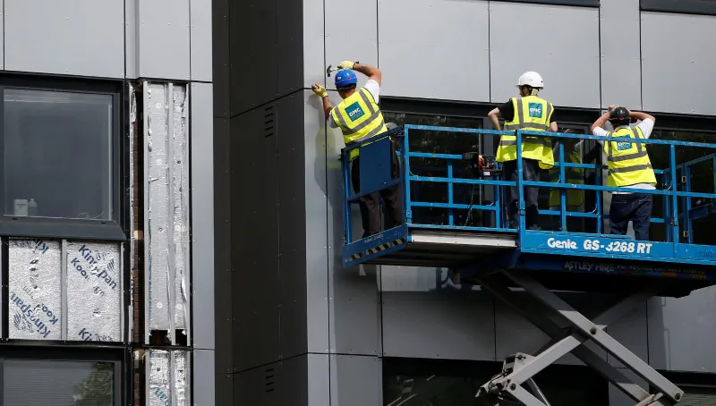 Cladding is removed from the side of Whitebean Court in Salford, Manchester, on June 26, 2017. (Andrew Yates /Reuters)