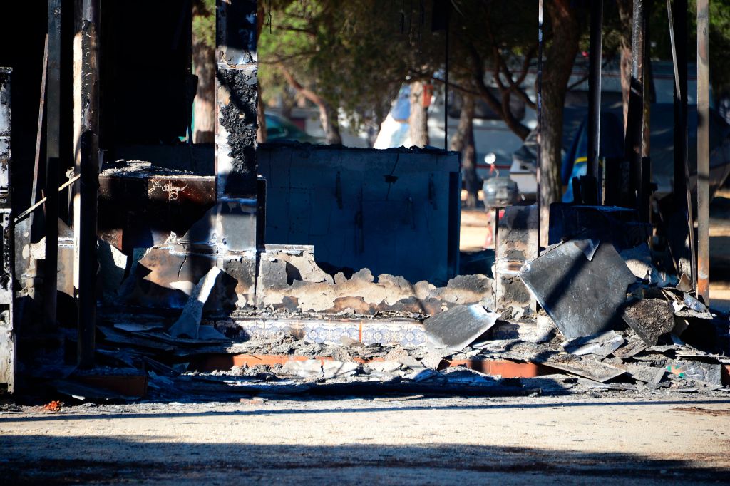 A picture taken on July 26, 2017 shows a burned building of a camping of Mazagon after a wildfire, near the Donana National Park. (CRISTINA QUICLER/AFP/Getty Images)