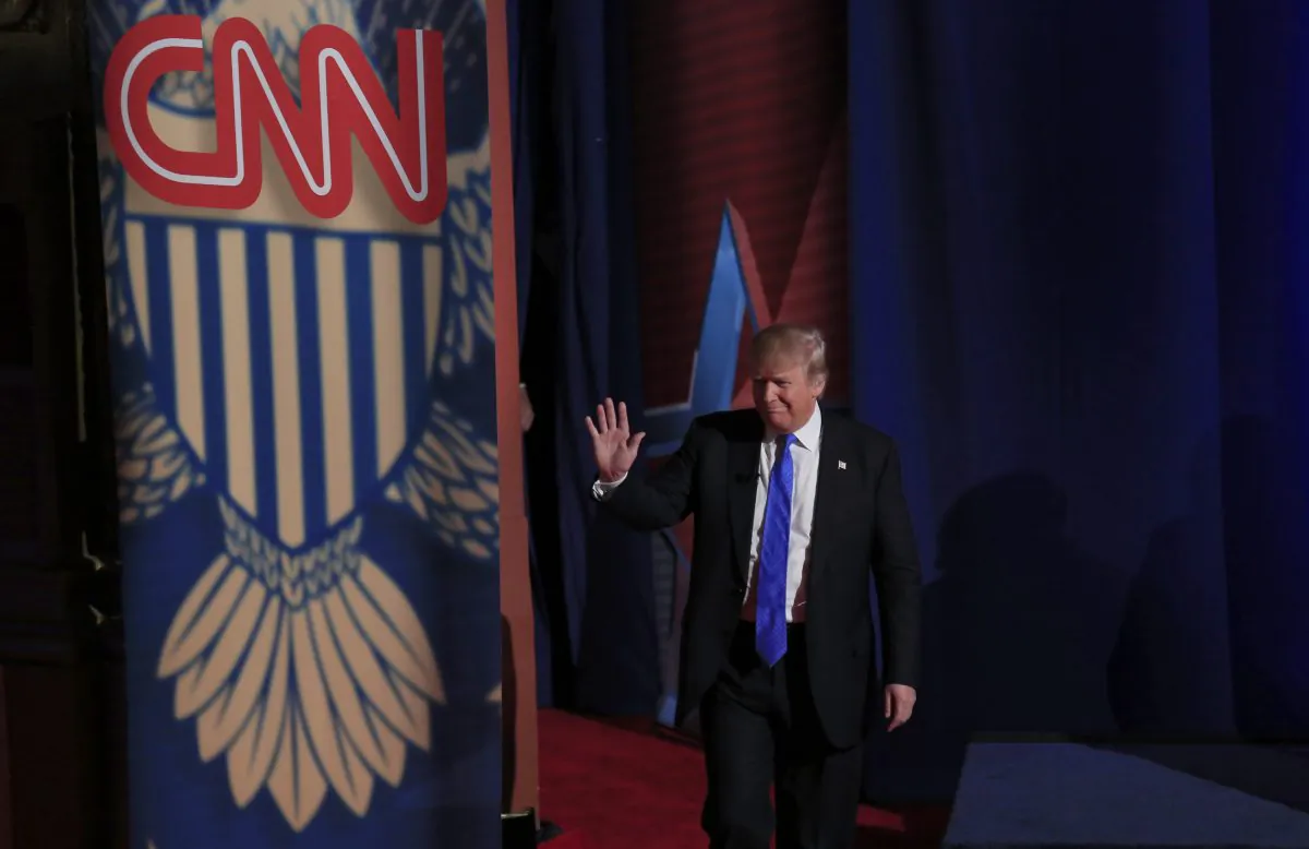 File Photo: Republican Presidential candidate Donald Trump enters the stage as he takes part in a town hall event moderated by Anderson Cooper March 29, 2016 in Milwaukee, Wisconsin. (Photo by Darren Hauck/Getty Images)