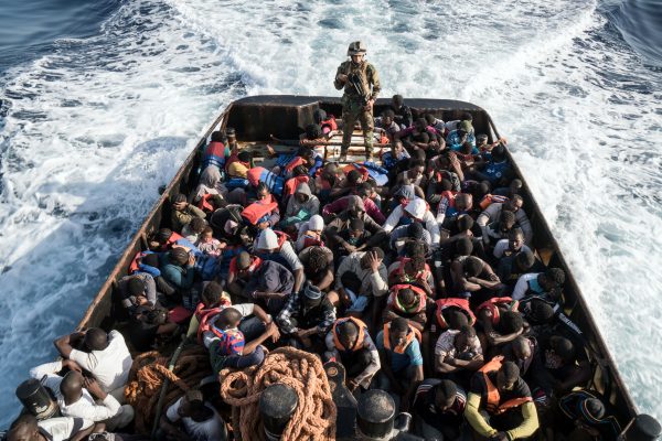 A Libyan coast guardsman on a boat