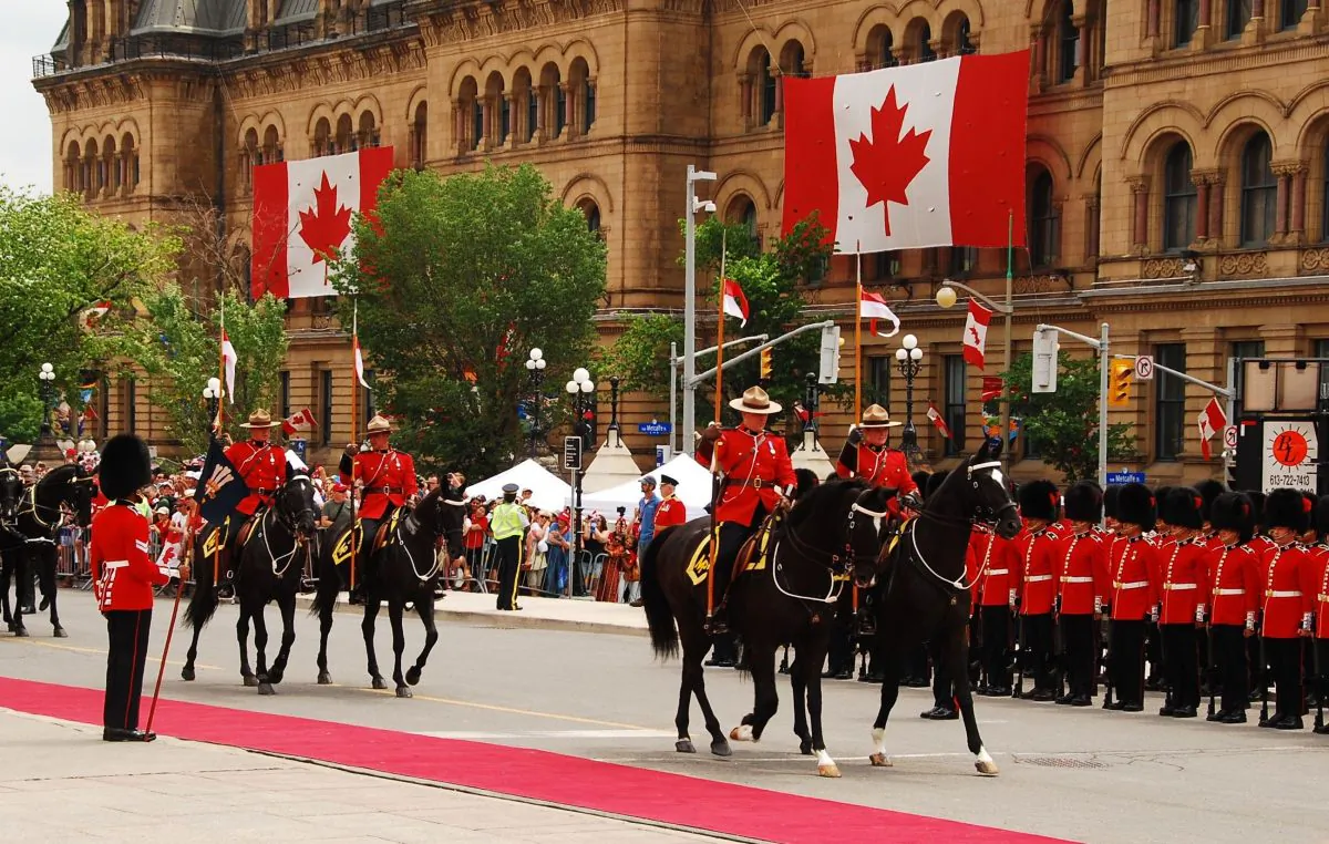 The RCMP take part in a Canada Day parade in Ottawa on July 1, 2016. (Jonathan Ren/The Epoch Times)