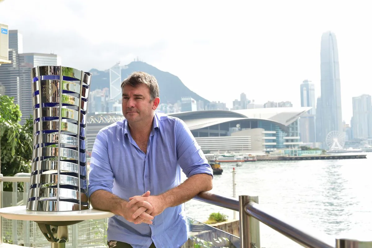 David Witt, skipper of the Sun Hung Kai entry for the Volvo Ocean Race 2017-18, standing beside the Volvo Ocean Race trophy at the Royal Hong Kong Yacht Club on Friday June 23. (Bill Cox/Epoch Times)