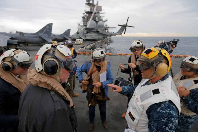 USS Bonhomme Richard amphibious assault ship Executive Officer Rich Lebron (2nd R) speaks to Australian journalists in the Pacific Ocean off the coast of Sydney, Australia, before a ceremony marking the start of Talisman Saber 2017, a biennial joint military exercise between the United States and Australia June 29, 2017.  REUTERS/Jason Reed