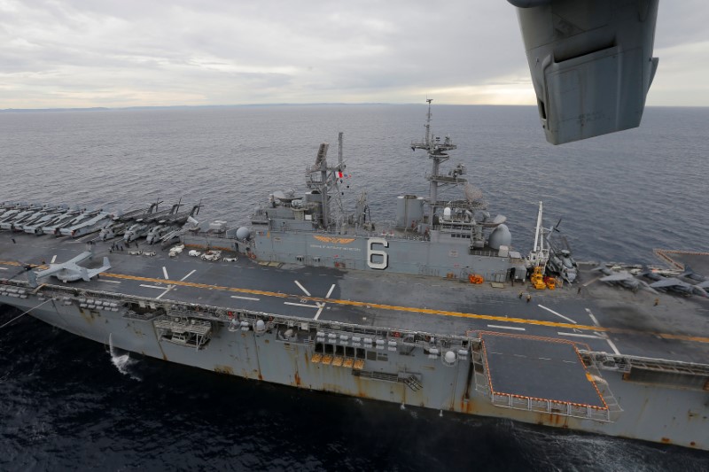 The USS Bonhomme Richard amphibious assault ship sails in the Pacific Ocean off the coast of Sydney, Australia, after a ceremony on board the ship marking the start of Talisman Saber 2017, a biennial joint military exercise between the United States and Australia,  June 29, 2017. REUTERS/Jason Reed