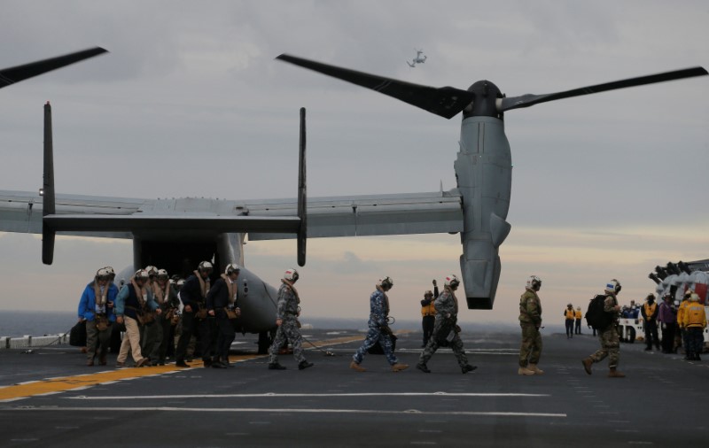 Participants in a ceremony marking the start of Talisman Saber 2017, a biennial joint military exercise between the United States and Australia, arrive on a U.S. Marines MV-22B Osprey Aircraft on the deck of the USS Bonhomme Richard amphibious assault ship off the coast of Sydney, Australia, June 29, 2017.   REUTERS/Jason Reed