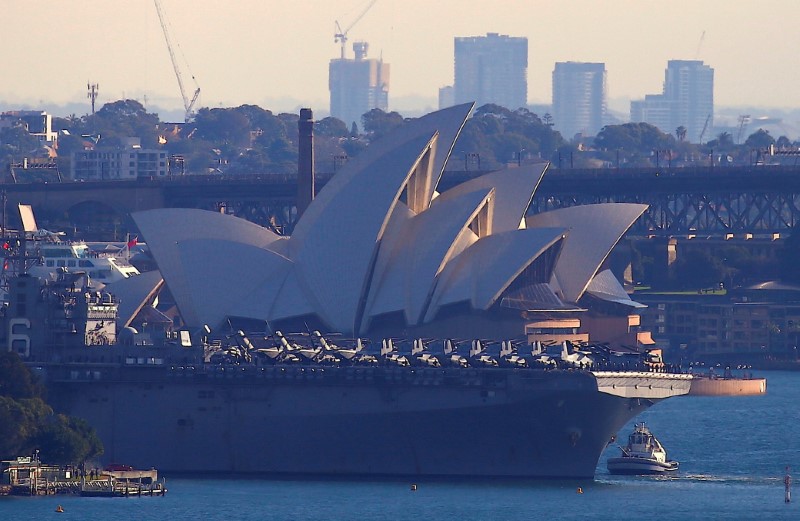 The USS Bonhomme Richard amphibious assault ship manoeuvres into port in front of the Sydney Opera House in Australia, June 29, 2017 after a ceremony on board the ship marking the start of Talisman Saber 2017, a biennial joint military exercise between the United States and Australia.    REUTERS/David Gray