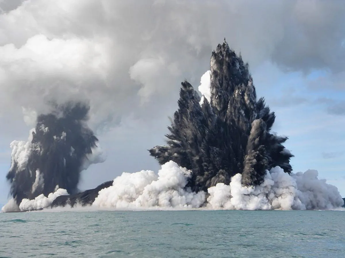 An undersea volcano is seen erupting off the coast of Tonga, sending plumes of steam, ash, and smoke up to 100 meters into the air on March 18, 2009. (Dana Stephenson/Getty Images)