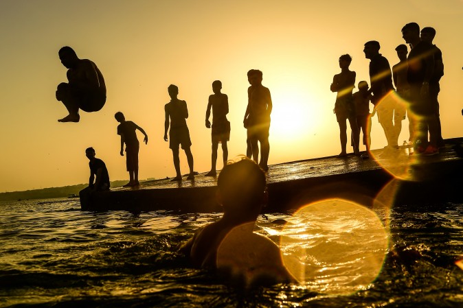 People dive in the sea at Menekse in Istanbul, Turkey, on July 2, 2017. Turkey was sweltering in a weekend heatwave that caused record temperatures in much of the country and triggered forest fires in the Aegean region. (YASIN AKGUL/AFP/Getty Images)