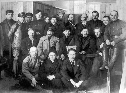 In the second row, starting from second left, are pictured Joseph Stalin, Vladimir Lenin, and Leon Trotsky as they gather for a meeting of the 8th Congress of the Bolshevik (later Soviet Communist) Party. (Public Domain)