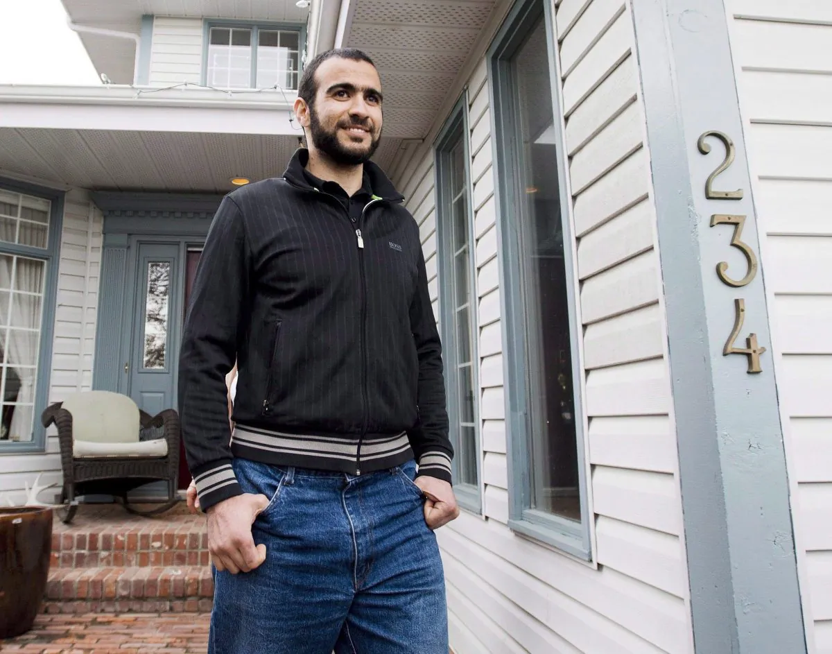 Omar Khadr walks out of his lawyer Dennis Edney's home to speak to the media in Edmonton, Alberta on May 7, 2015. (The Canadian Press/Nathan Denette)
