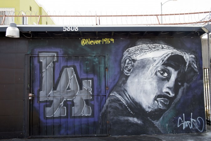 A wall dedicated to the memory of US rapper Tupac Shakur is seen on May 26, 2016 in Los Angeles, California. Twenty years after his death, Tupac still reigns. Other rappers have succeeded him in stardom, and promotional efforts around Tupac have been haphazard, but the artist who died at age 25 on September 13, 1996, in Las Vegas, maintains a hold that is among the most enduring in recent times. / AFP / VALERIE MACON / TO GO WITH AFP STORY by Shaun TANDON, "20 years on, Tupac reigns as potent global force" (Photo credit should read VALERIE MACON/AFP/Getty Images)