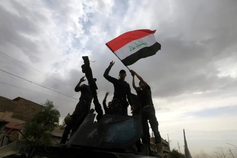 Members of the Emergency Response Division celebrate in the Old City of Mosul, Iraq July 8, 2017. (Reuters/Alaa Al-Marjani)