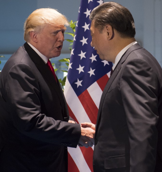US President Donald Trump and Chinese President Xi Jinping (R) shake hands prior to a meeting on the sidelines of the G20 Summit in Hamburg, Germany, July 8, 2017. (Saul Loeb/AFP/Getty Images)