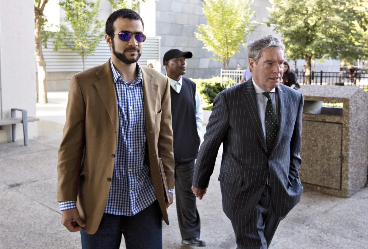Omar Khadr and his lawyer Dennis Edney arrive at Khadr's bail conditions hearing in Edmonton, Alta., on Sept. 11, 2015. THE CANADIAN PRESS/Jason Franson