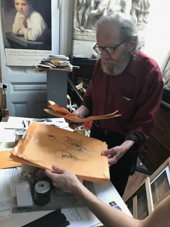 Harvey Dinnerstein shows a recent sketch he made of a cab driver in his studio in Brooklyn, New York, on May 31, 2017. (Milene Fernandez/The Epoch Times)