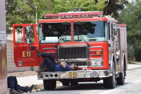Firefighters from a Burbank engine company take a break after working all night tackling the Whittier Fire near Santa Barbara, California, U.S. in this July 15, 2017 handout photo. (Mike Eliason/Santa Barbara County Fire Department/Handout via Reuters)