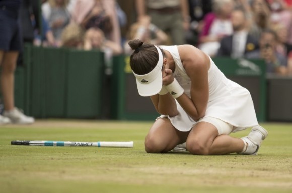 Garbine Muguruza celebrates match point during her women's finals match against Venus Williams on day twelve at the All England Lawn Tennis and Croquet Club, Jul 15, 2017. (Susan Mullane/USA Today Sports)