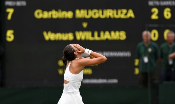 Spain's Garbine Muguruza celebrates winning the final against Venus Williams of the U.S, at Wimbledon in London, July 15, 2017. (Reuters/Tony O'Brien)