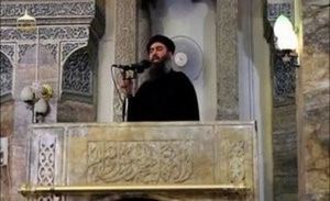 A man purported to be the reclusive leader of ISIS Abu Bakr al-Baghdadi making what would have been his first public appearance, at a mosque in the centre of Iraq's second city, Mosul, according to a video recording posted on the Internet on July 5, 2014, in this still image taken from video. (REUTERS/Social Media Website via Reuters TV)