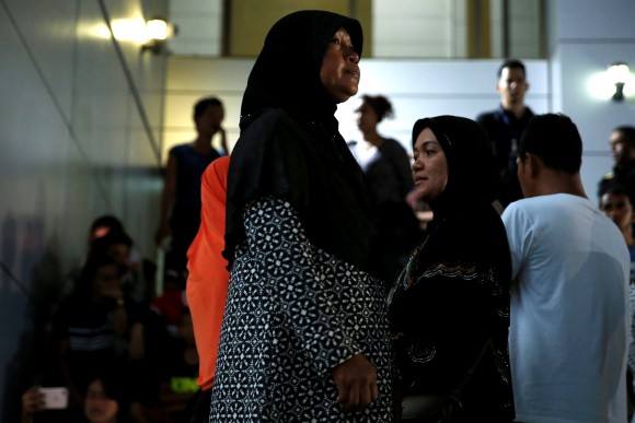 Relatives of victims of human trafficking wait for the sentence after an army general, two provincial politicians and police officers were among the 46 people held guilty in a court in Bangkok, Thailand, July 19, 2017. (Reuters/Jorge Silva)