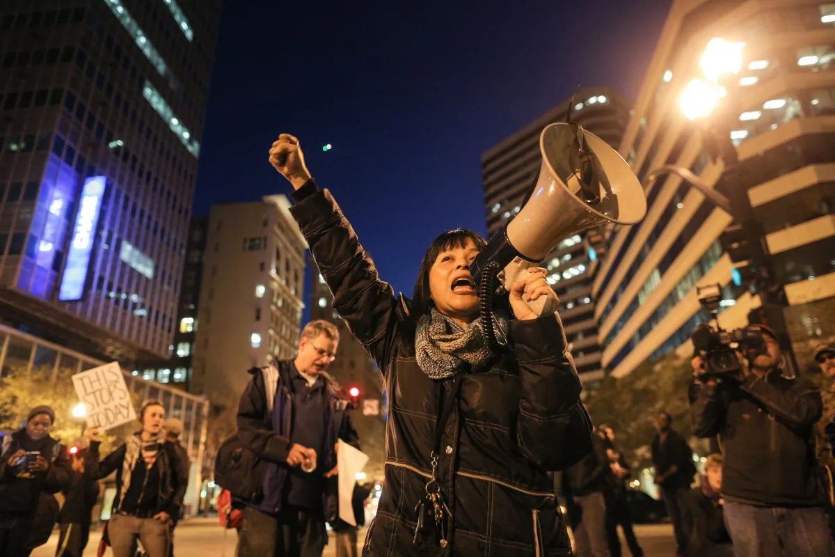 Yvette Felarca of Oakland speaks to the crowd on the second night of demonstrations following a Staten Island, New York grand jury's decision not to indict a police officer in the chokehold death of Eric Garner on December 4, 2014 in Oakland, California.  (Elijah Nouvelage/Getty Images)