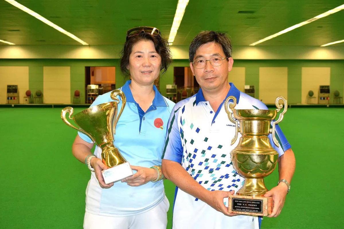 Danna Chiu (L) of Tuen Mun Sports Association and CT Wong of Hong Kong Football Club proudly display their first National Indoor Singles trophy after winning in the finals last Saturday, July 15, 2017. (Stephanie Worth)