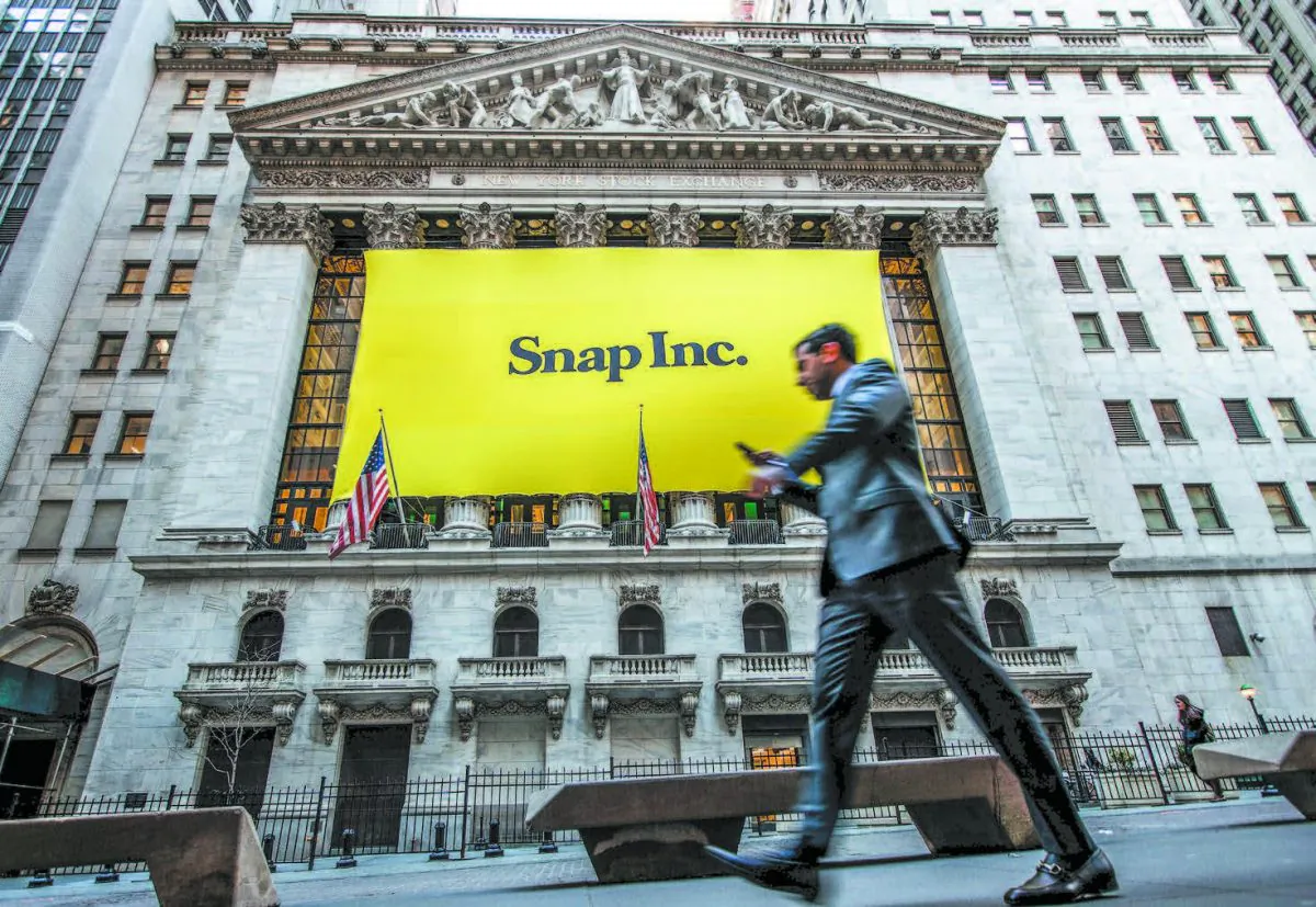 Signage for Snap Inc., parent company of Snapchat, on the front of the New York Stock Exchange on March 2. (DREW ANGERER/GETTY IMAGES)