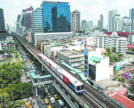 A SKY TRAIN IN BANGKOK ON MARCH 20, 2013. Thailand will borrow a total of $69.5 billion to fund high-speed railways and other transportation mega projects, with most of the money coming from China and Chinese companies providing the construction. Thailand's railways will form part of the Kunming– Singapore railway system. However, Thailand will repay the loans with rice and rubber exports, thus running a trade surplus with China and going against the objective to generate export growth. (NICOLAS ASFOURI/AFP/GETTY IMAGES)