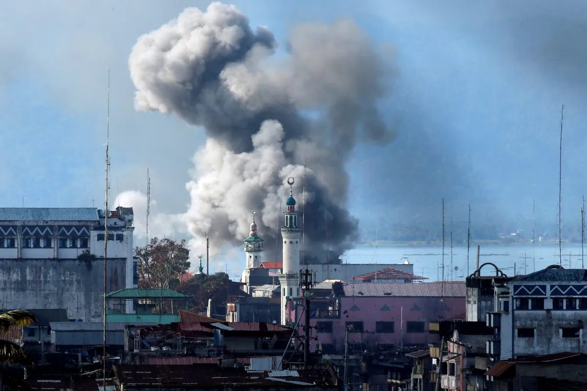 An explosion is seen after a Philippines army aircraft released a bomb during an airstrike as government troops continue their assault against terrorists from the Maute group in Marawi city June 27, 2017. (Reuters/Jorge Silva)