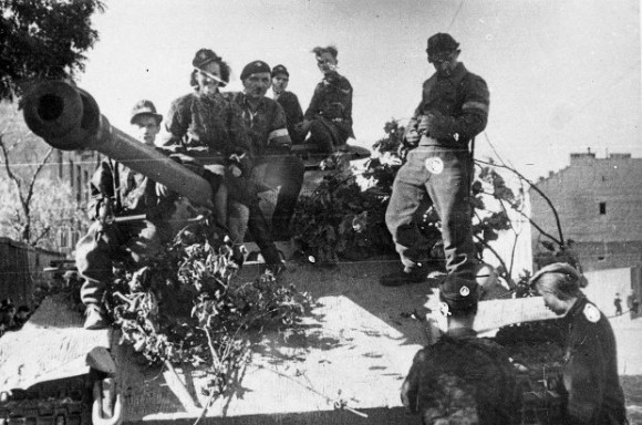 Soldiers of the Polish Home Army ride a captured German Panther tank on Aug. 2 1944, during the Warsaw Uprising. (Juliusz Bogdan Deczkowski/Public Domain)