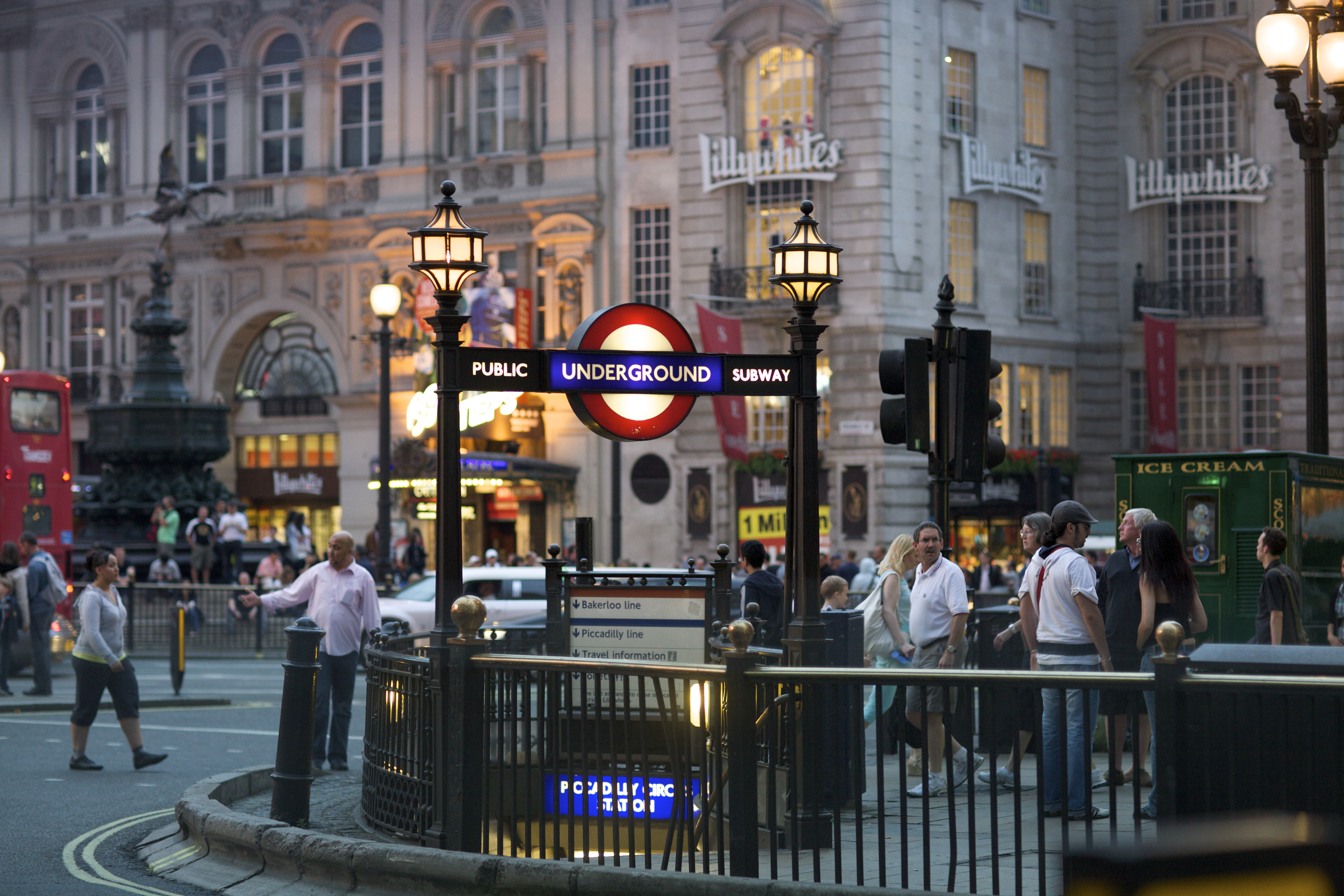 Piccadilly Circus street at night with underground tube station on June 28, 2009 in London, England. London's underground railway is the oldest in the world, dating back to 1863. (Stephen Bures/Shutterstock)