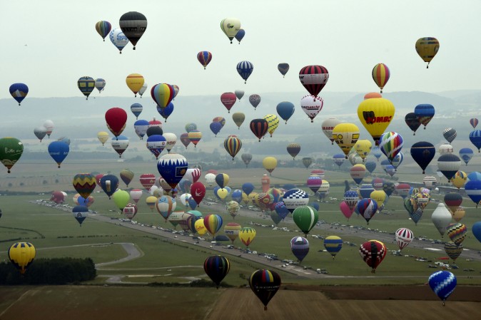 Hot air-balloons before the world record attempt of the biggest line with 456 balloons at the Mondial Air Ballons event at Chambley-Bussieres airbase, France, on July 28, 2017. (ALEXANDRE MARCHI/AFP/Getty Images)