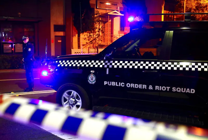 A policeman stands on a street that has been blocked to the public after Australian counter-terrorism police arrested four people in raids late on Saturday across several Sydney suburbs in Australia, July 29, 2017. (Reuters/David Gray)