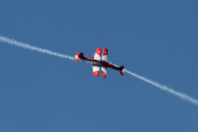 PC-7 Pilatus planes of the Swiss Air Force Aerobatics Team cross during a flight display prior to the final of the Swiss Open ATP 250 tennis tournament in Gstaad on July 30, 2017. (FABRICE COFFRINI/AFP/Getty Images)