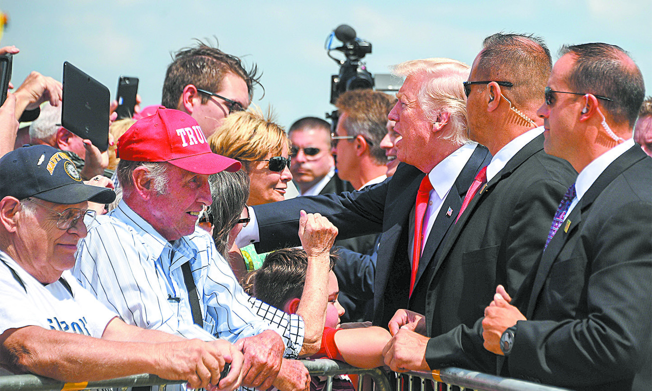President Donald Trump greets supporters as he arrives in Springfield, Mo., on Aug. 30. (JIM WATSON/AFP/GETTY IMAGES)