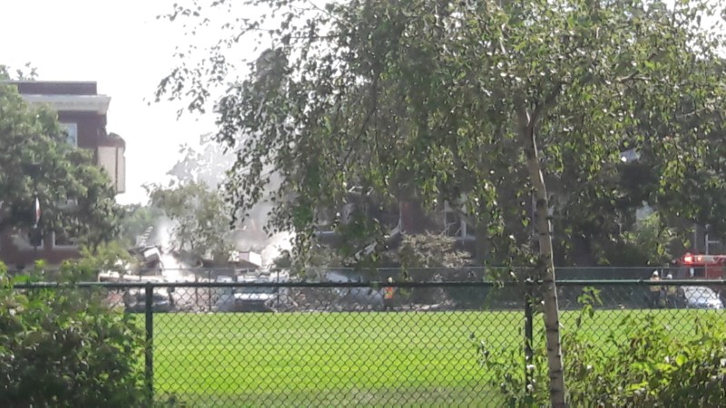 Emergency vehicles attend the scene outside the Minnehaha Academy, after part of the Christian private school collapsed, in Minneapolis, United States August 2, 2017 in this image obtained from social media.  Steven Appelget/via REUTERS