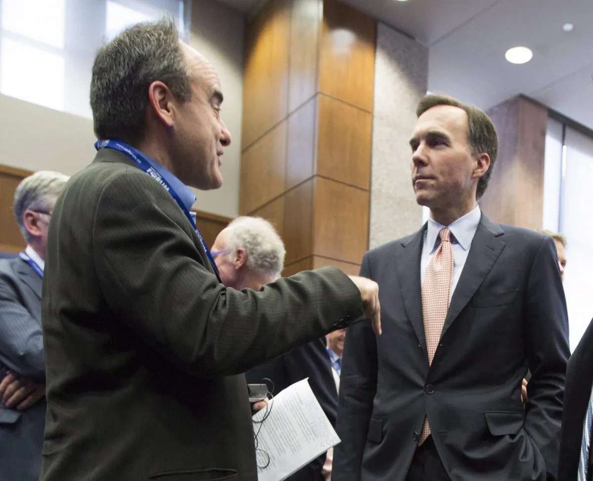 Finance minister Bill Morneau speaks with John Ruffolo, CEO of OMERS Ventures at the Munk School of Global Affairs in Toronto in 2016. Through supporting venture capital, the government aims to support innovative small companies in Canada.
 (The Canadian Press/Peter Power)