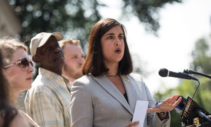 Nicole Malliotakis, Republican New York City mayoral candidate, holds up a letter demanding information about Mayor Bill De Blasio's foreign travel while speaking during a press conference outside City Hall, in New York City on July 19, 2017. (Drew Angerer/Getty Images)