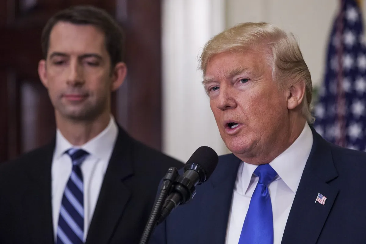 President Donald Trump, accompanied by Sen. Tom Cotton, makes an announcement in the Roosevelt Room at the White House, on August 2, 2017. (Zach Gibson/Getty Images)
