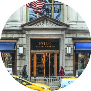 People walk by Ralph Lauren's flagship Fifth Avenue Polo store in New York City on April 4. (PHOTO BY GETTY IMAGES)